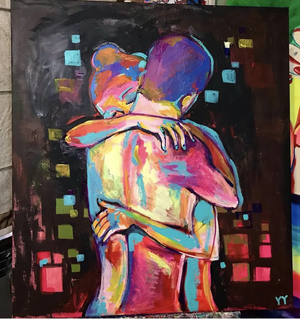 Embrace by Yana Yank: two figures locked in a tight embrace, their bodies built from blocks of pink, orange, violet and turquoise on a dark ground