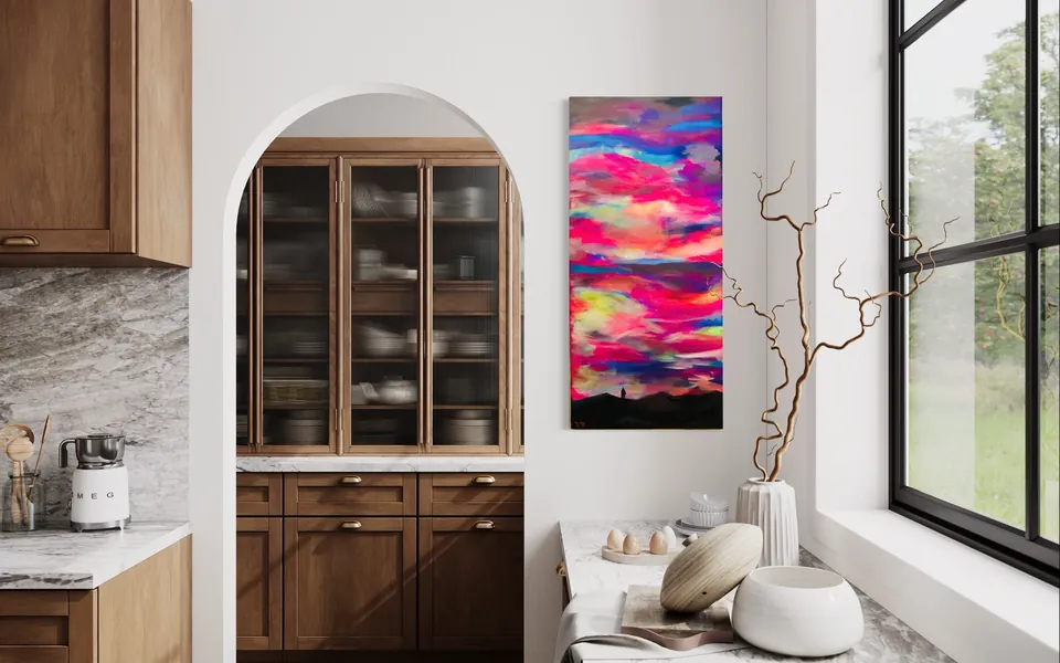A tall pink and violet sky painting by Yana Yank in a bright kitchen with an arched doorway